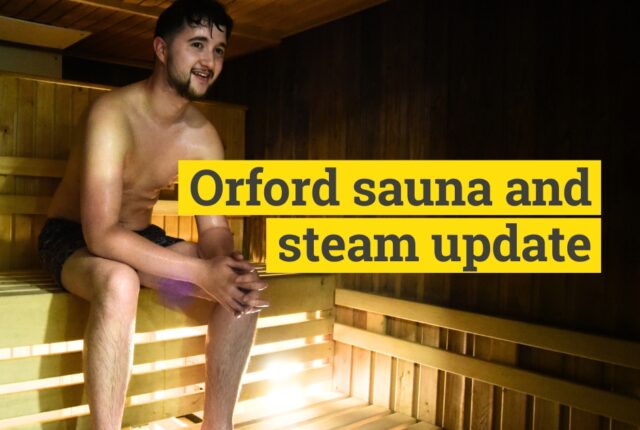 young man sat in sauna and steam