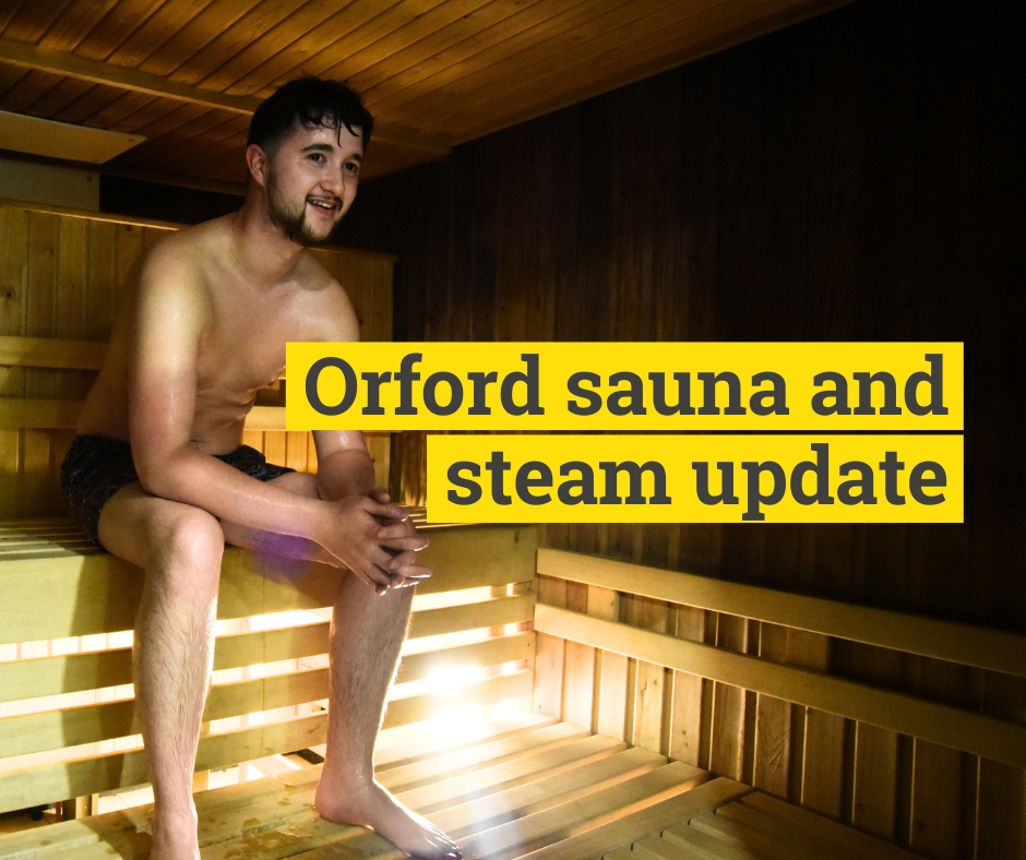 young man sat in sauna and steam